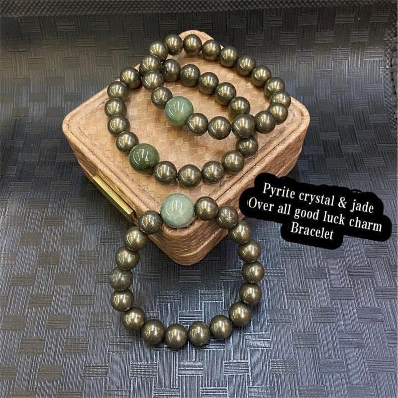 Pyrite crystal & jade over all good luck 
Charm bracelet  size 7.5