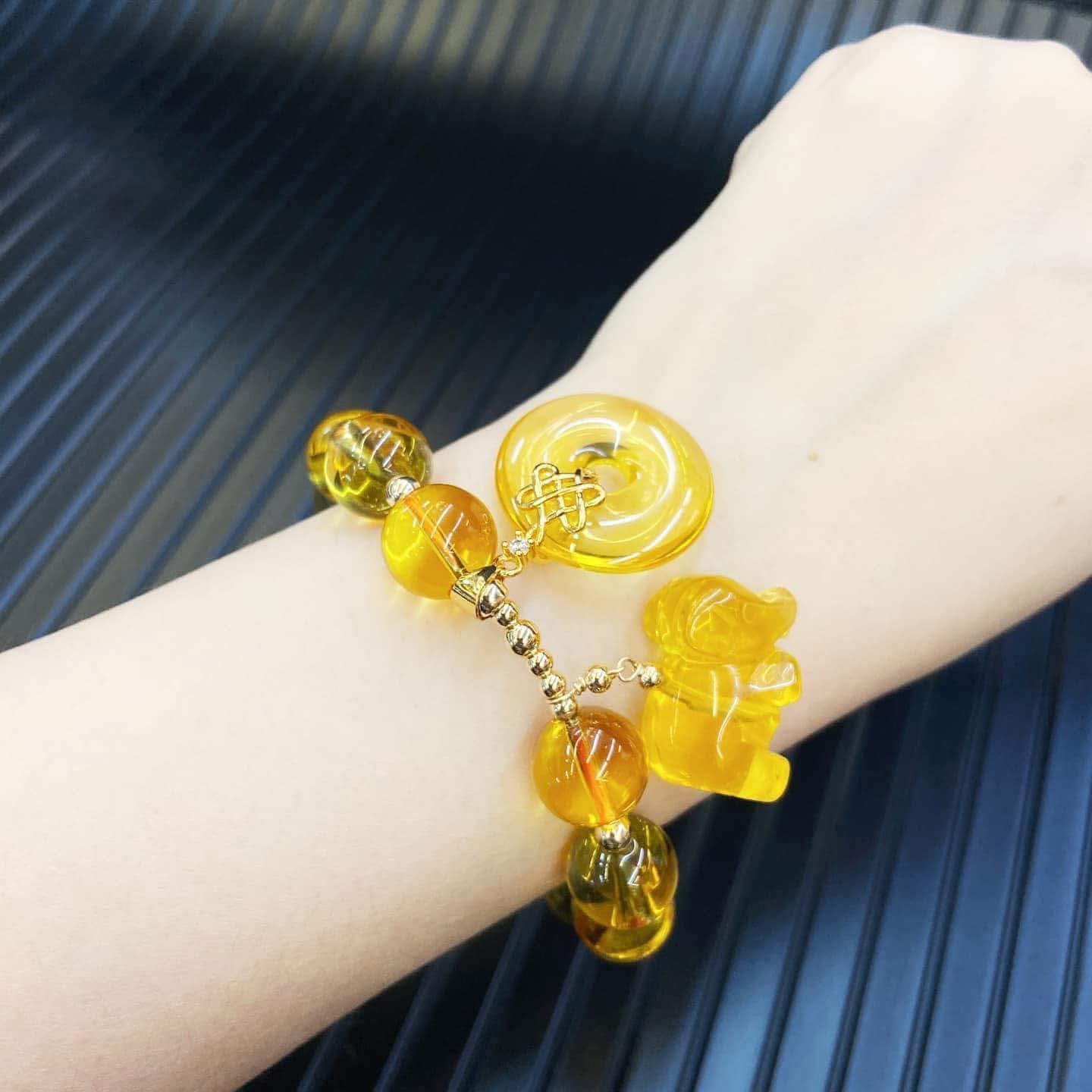 Citrine mystic knot & elephant over all
Good luck charm bracelet