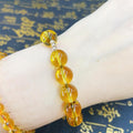 Citrine stone w/ Rosary style lucky 

Charm bracelet